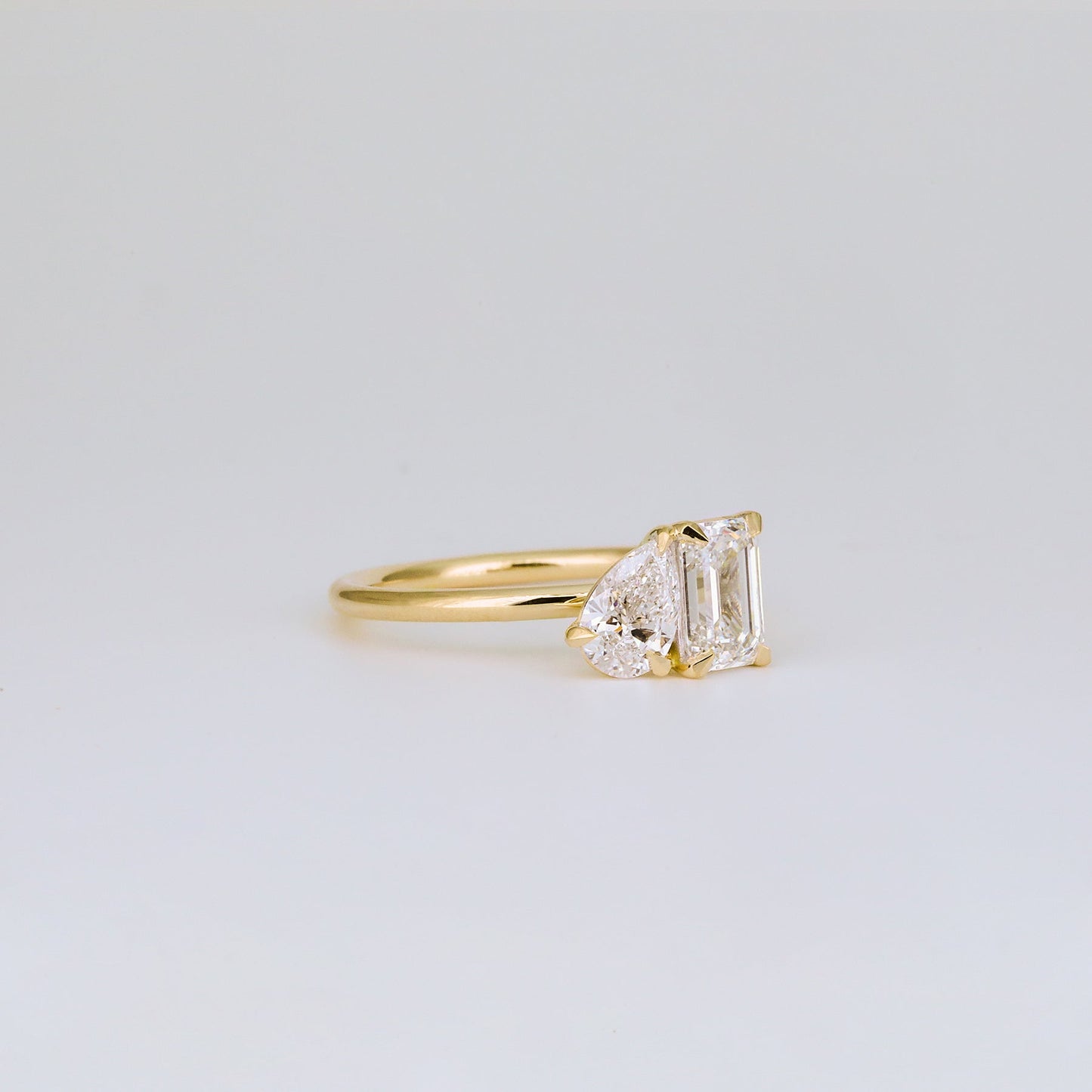 1.47 TCW Emerald & Pear Shaped Toi Et Moi Moissanite Engagement Ring