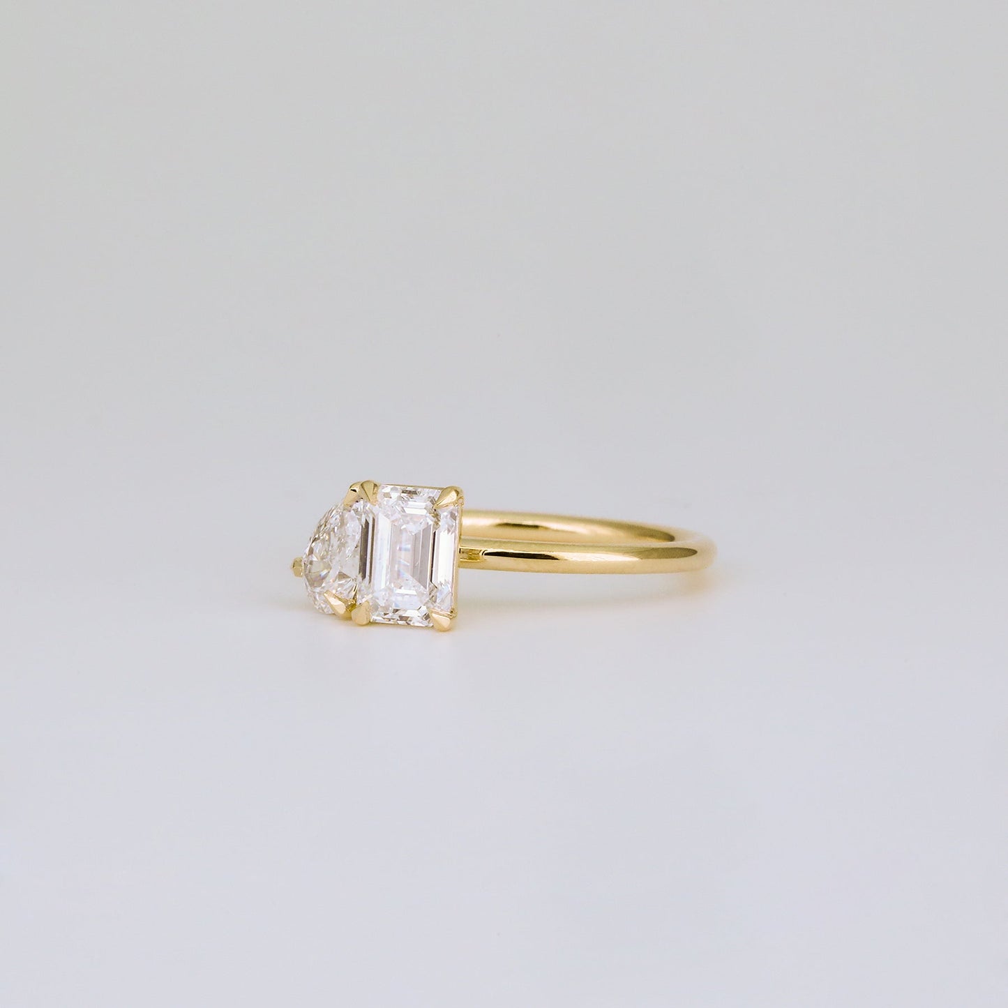 1.47 TCW Emerald & Pear Shaped Toi Et Moi Moissanite Engagement Ring