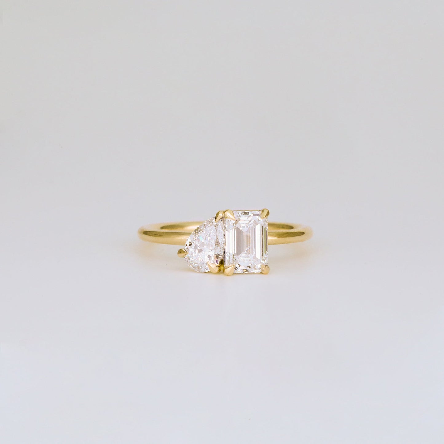 1.47 TCW Emerald & Pear Shaped Toi Et Moi Moissanite Engagement Ring