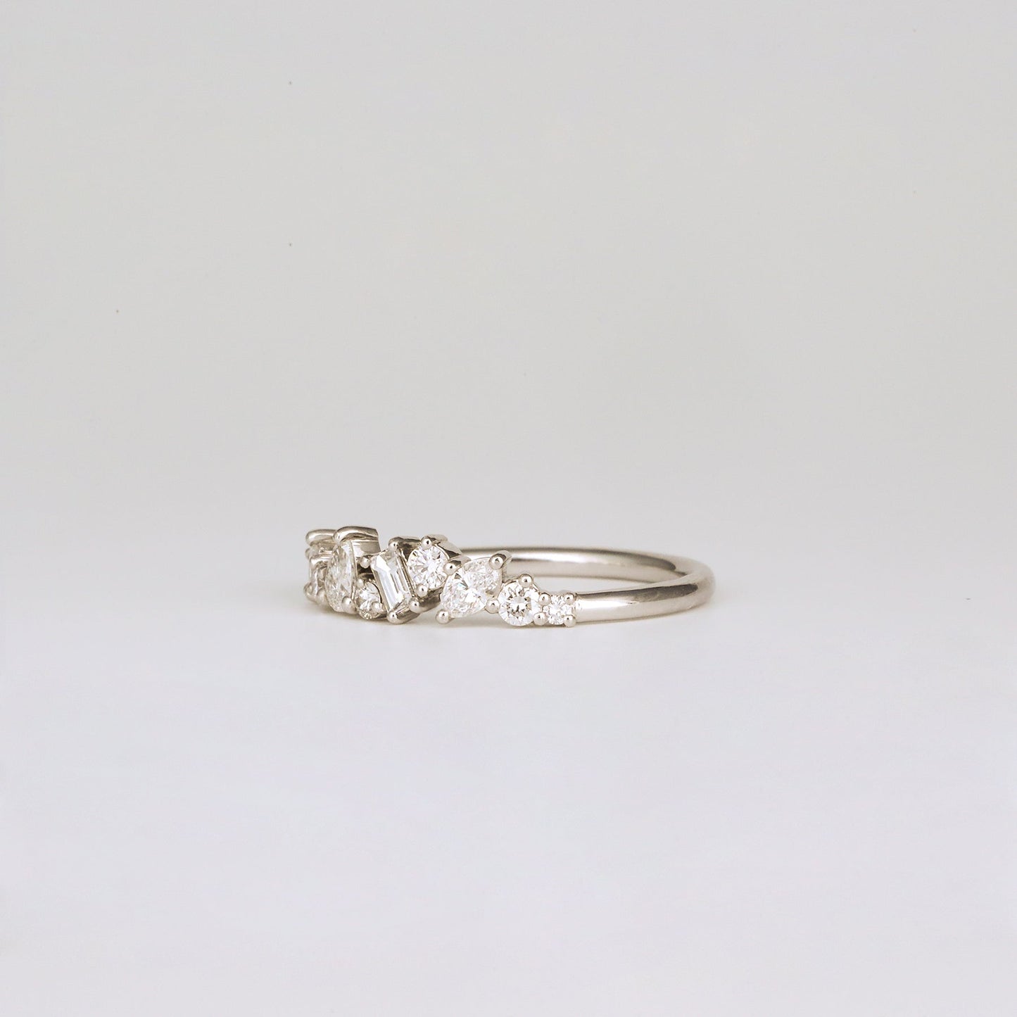 0.57 TCW Round, Baguette, Pear & Marquise Shaped Multi Stone Moissanite Wedding Band