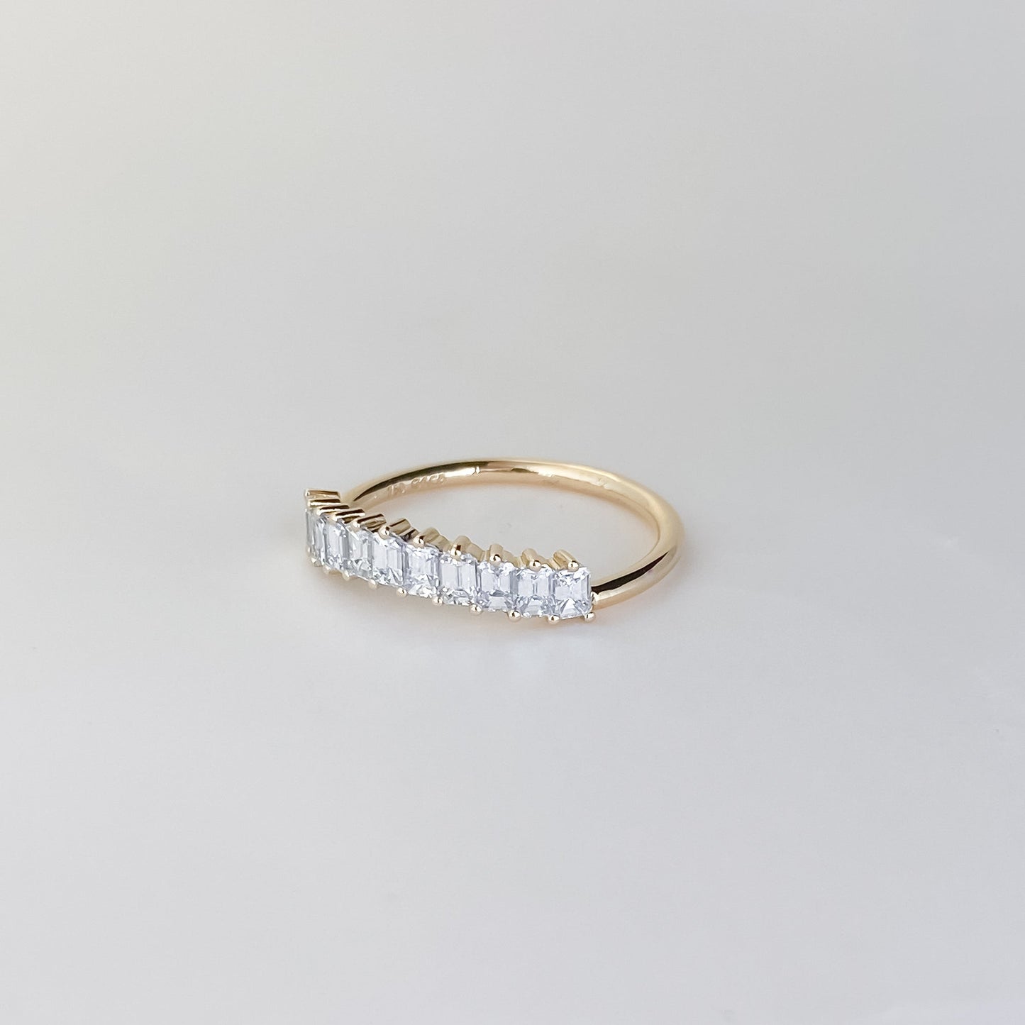 0.68 TCW Emerald Shaped Curved Moissanite Wedding Band