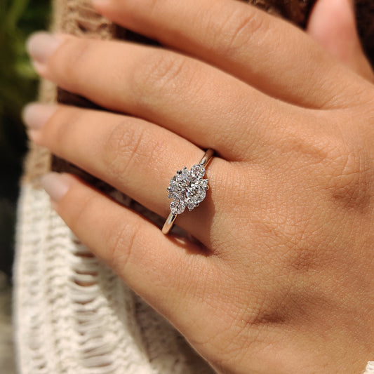 Oval Diamond Ring With Round Cut Side Stone