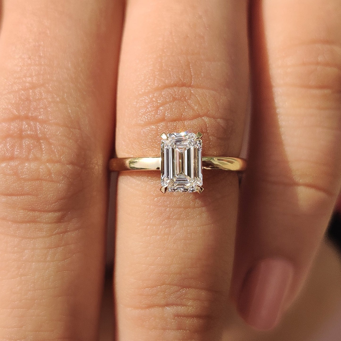 Emerald Cut Solitaire Ring In Yellow Gold With Basket Design