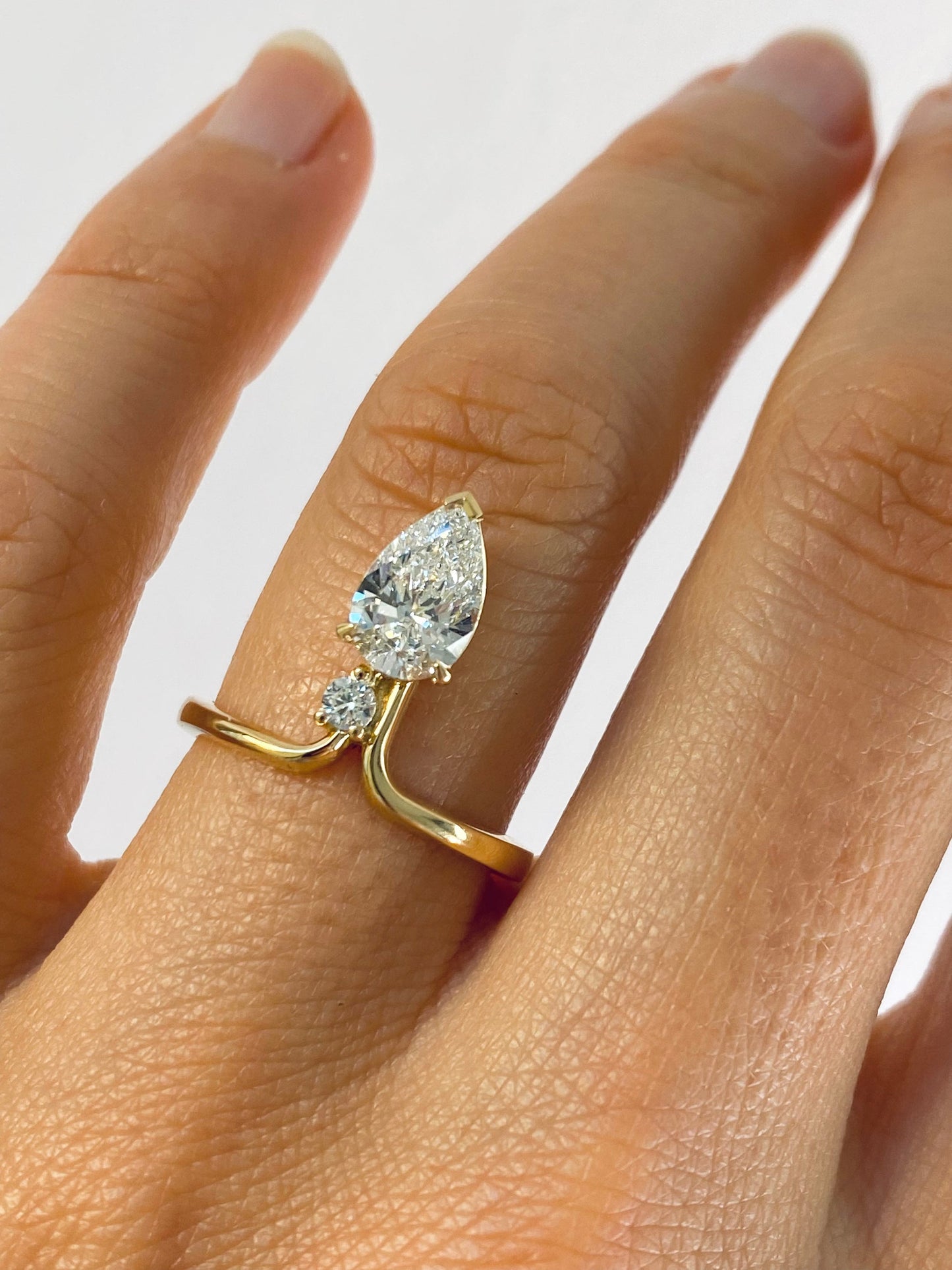 1.12 TCW Pear & Round Unique Moissanite Engagement Ring