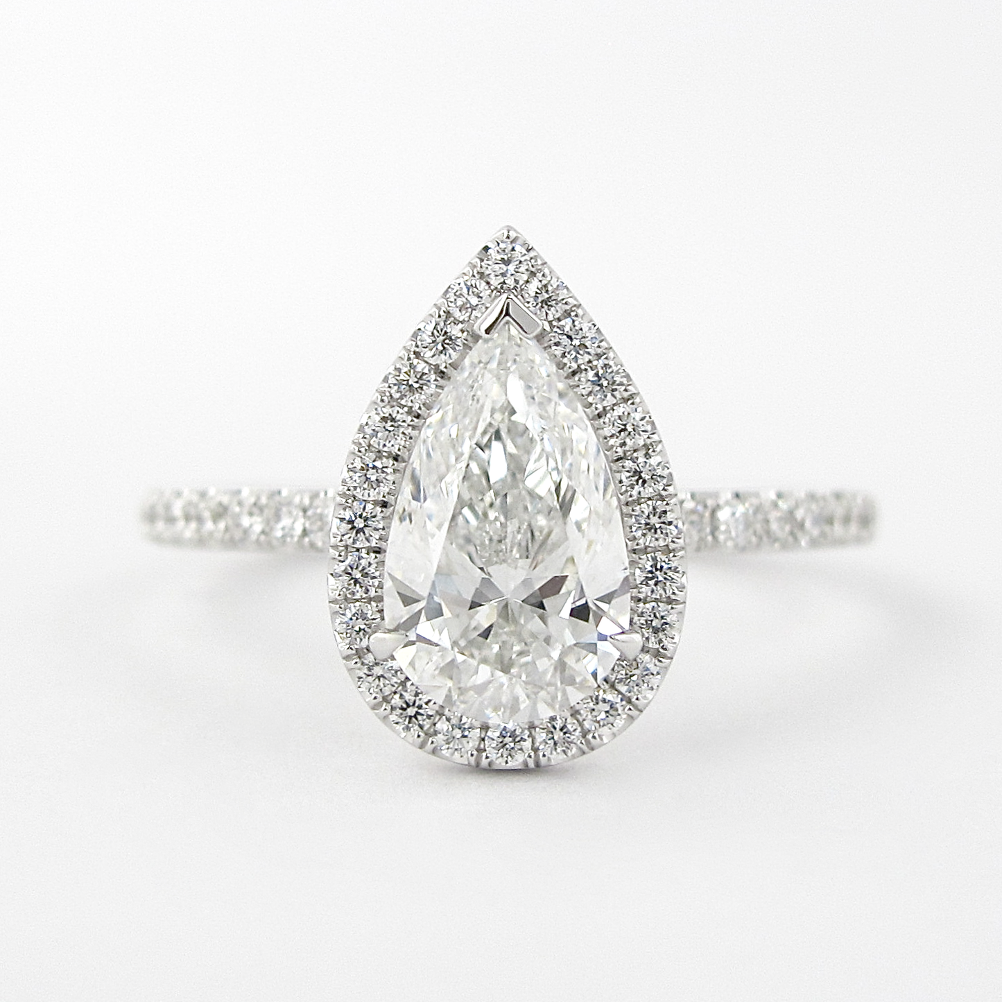 1.5 CT Pear Cut Halo Style Moissanite Engagement Ring 1