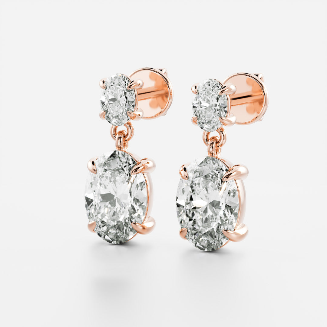 1.2 TCW Oval Cut Moissanite Dangles Earrings in Gold
