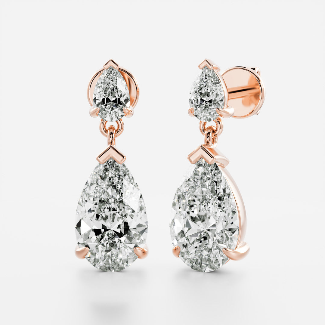 1.2 TCW Pear Cut Moissanite Dangles Earrings in Gold