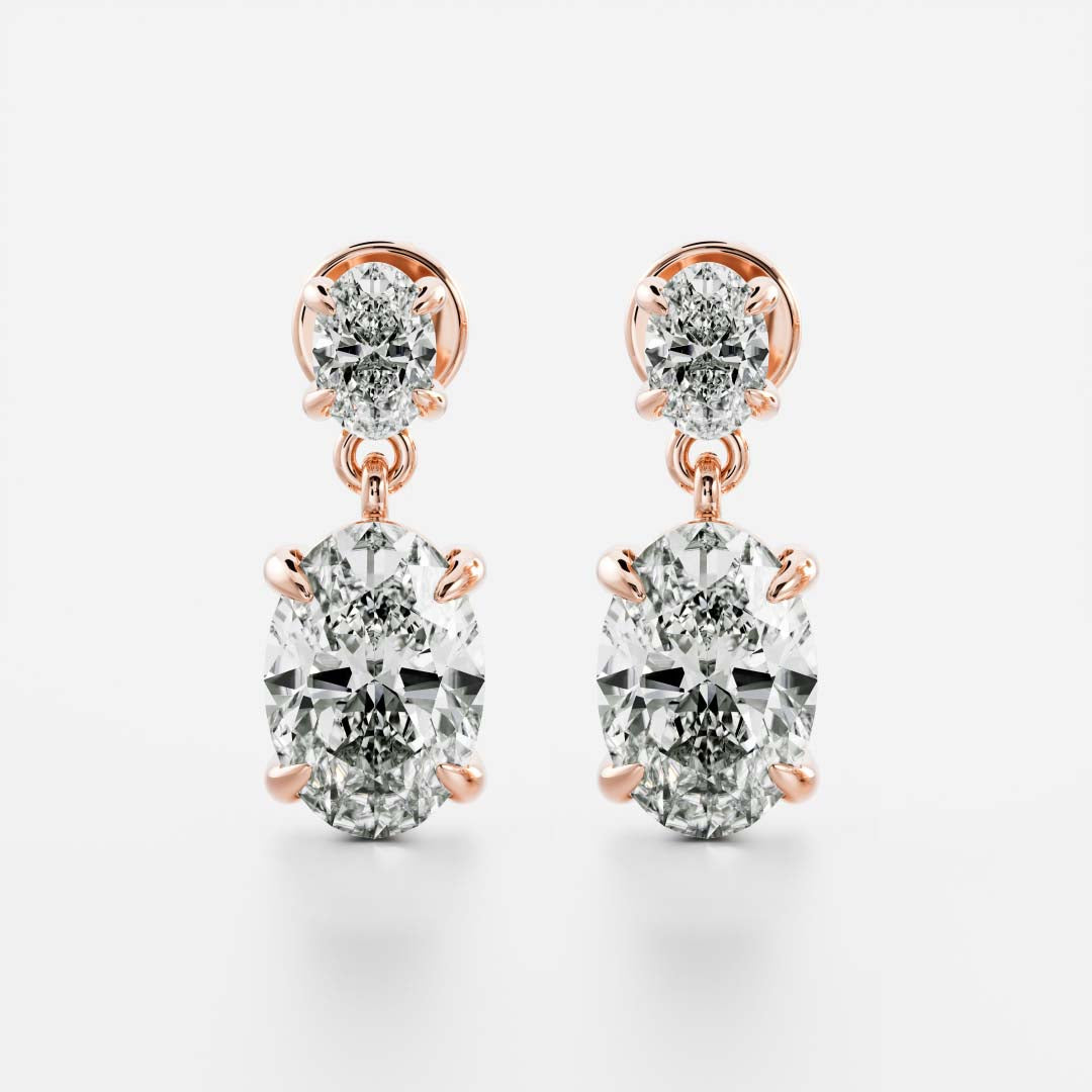 1.2 TCW Oval Cut Moissanite Dangles Earrings in Gold