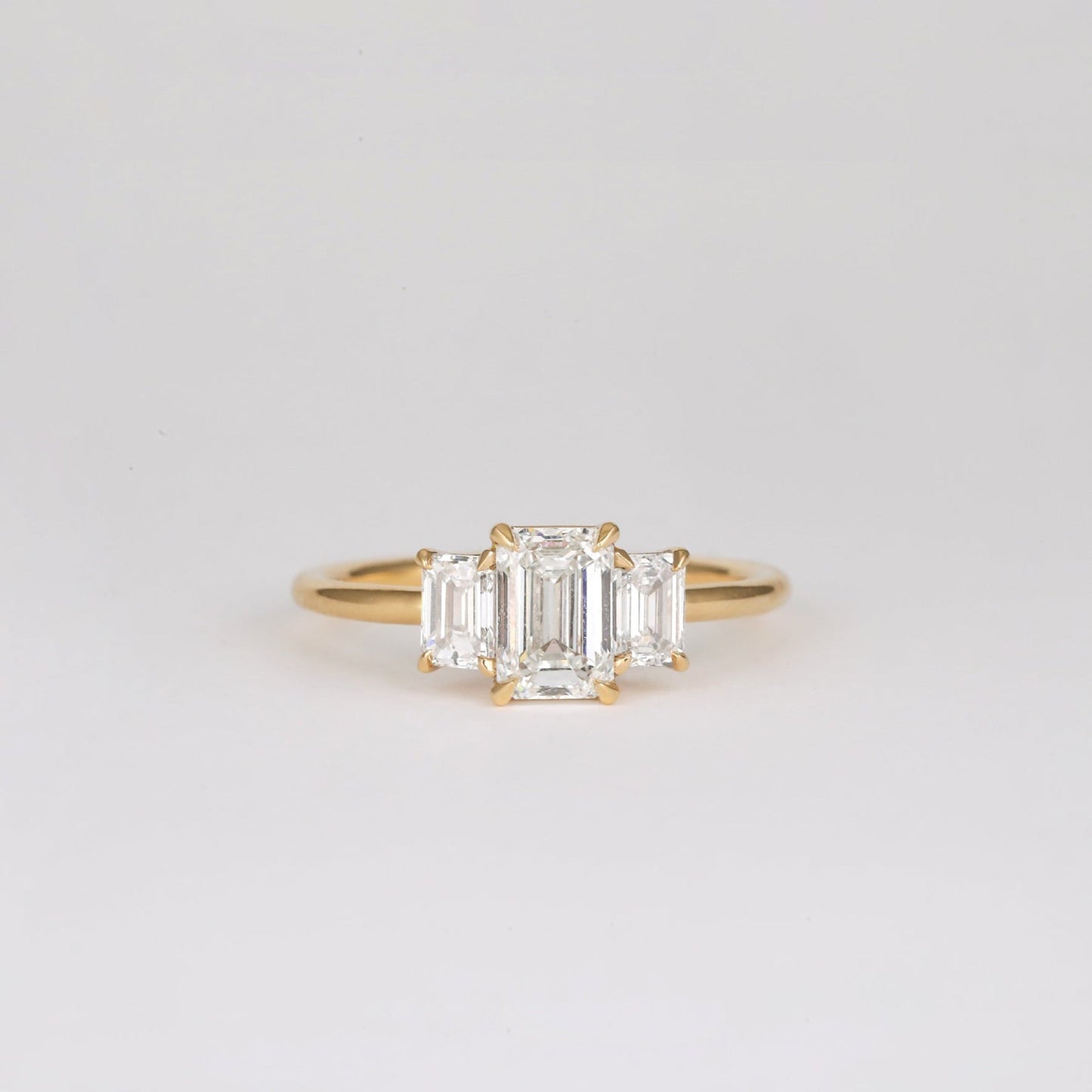 0.90 CT Emerald Shaped Three Stone Moissanite Engagement Ring