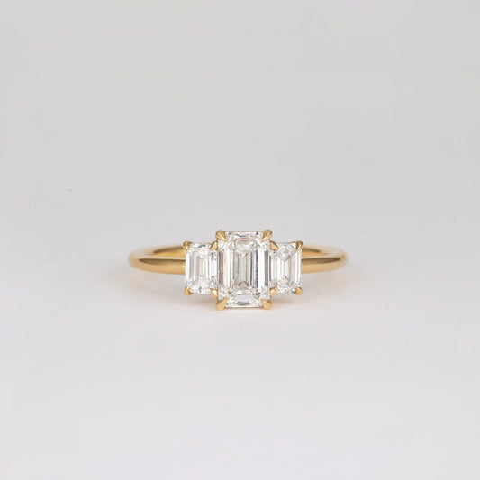 0.90 CT Emerald Shaped Three Stone Moissanite Engagement Ring