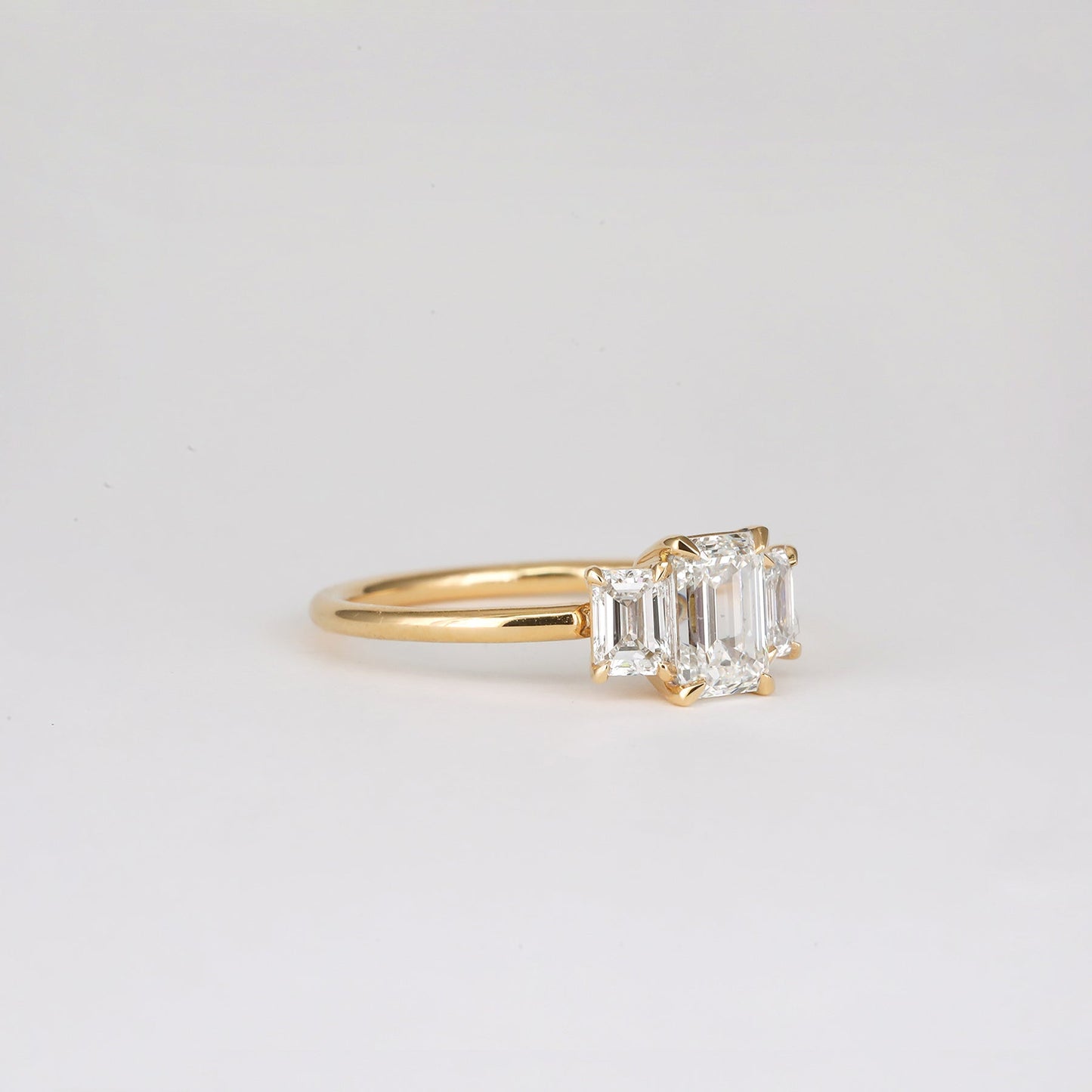 0.90 CT Emerald Shaped Three Stone Moissanite Engagement Ring