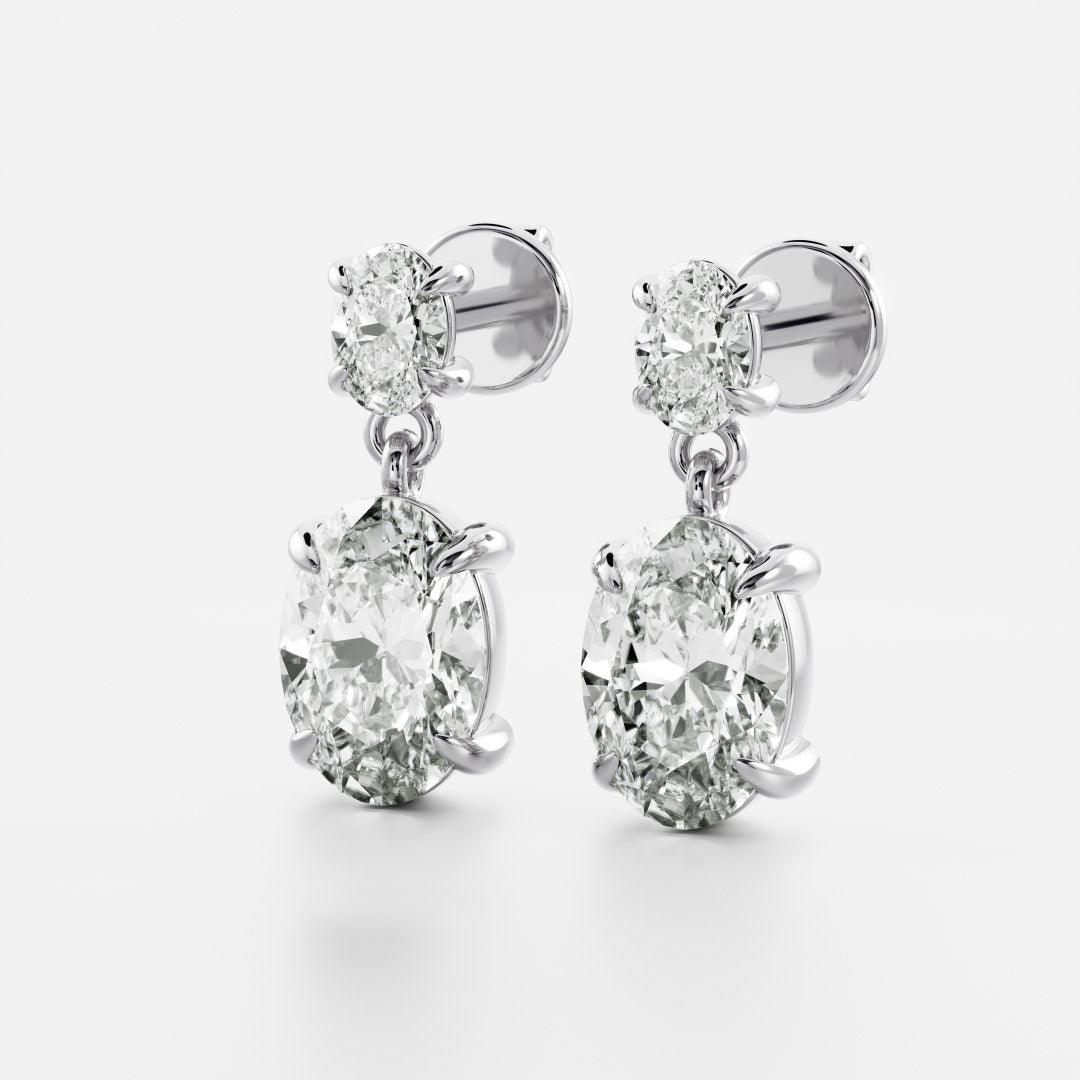 1.2 TCW Oval Cut Moissanite Dangles Earrings in Gold