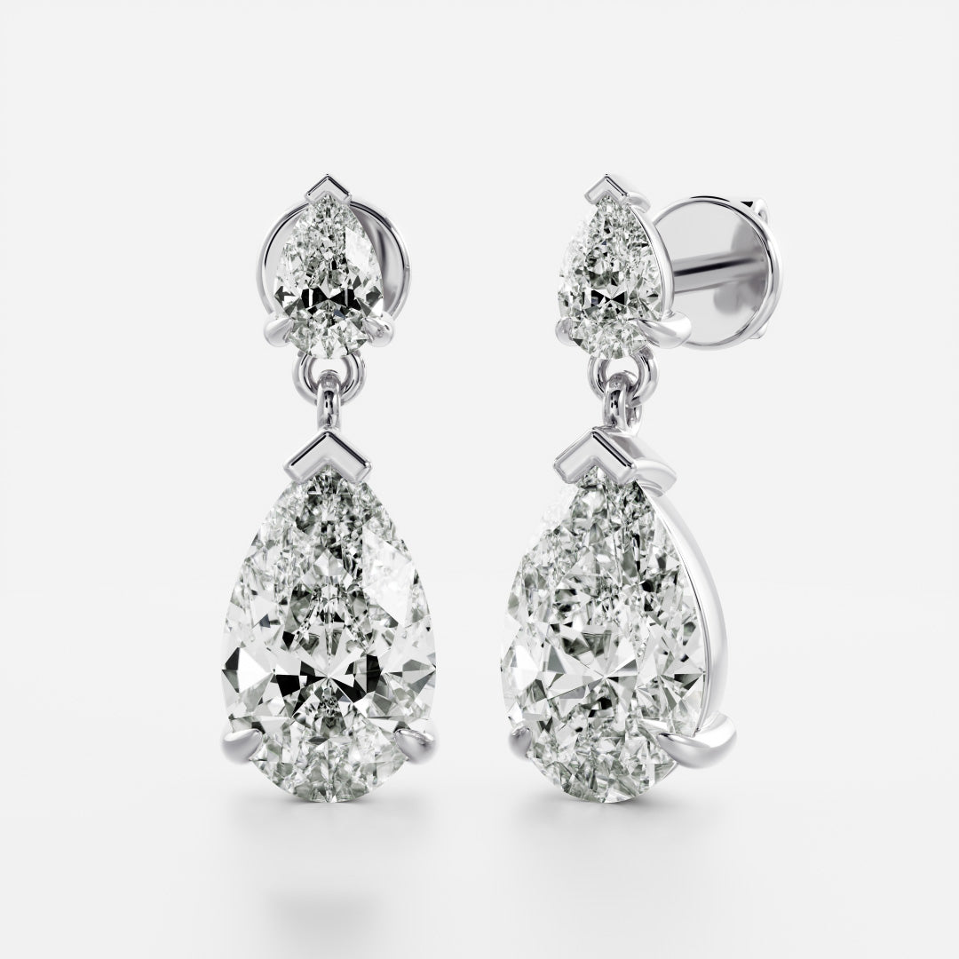 1.2 TCW Pear Cut Moissanite Dangles Earrings in Gold