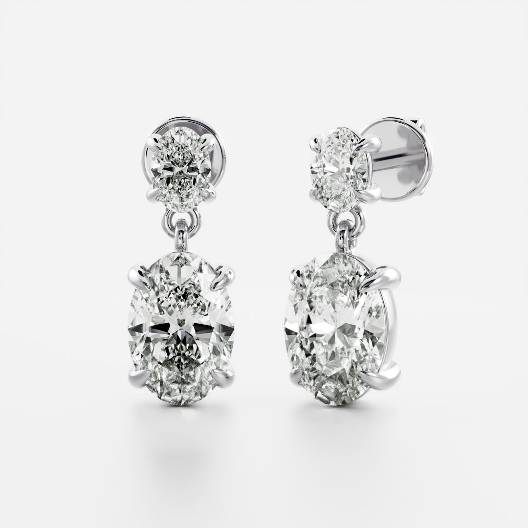 1.2 TCW Oval Cut Moissanite Dangles Earrings in Gold