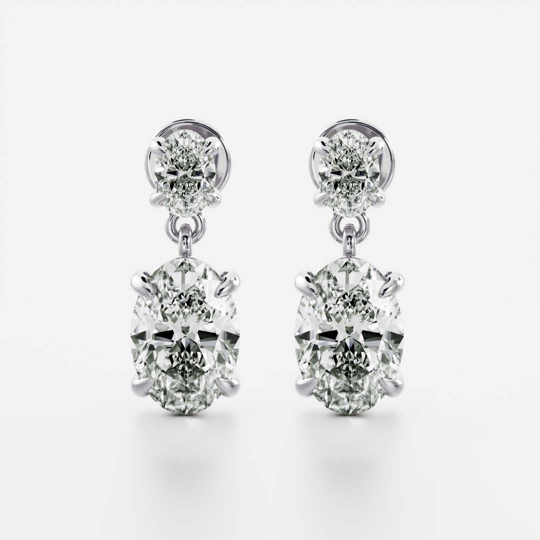 1.2 TCW Oval Cut Moissanite Dangles Earrings in Gold