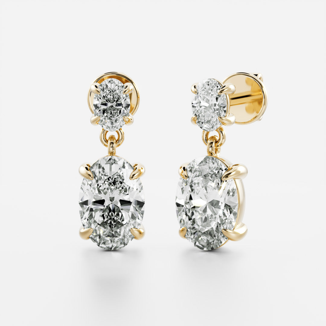 1.2 TCW Oval Cut Moissanite Dangles Earrings in Gold