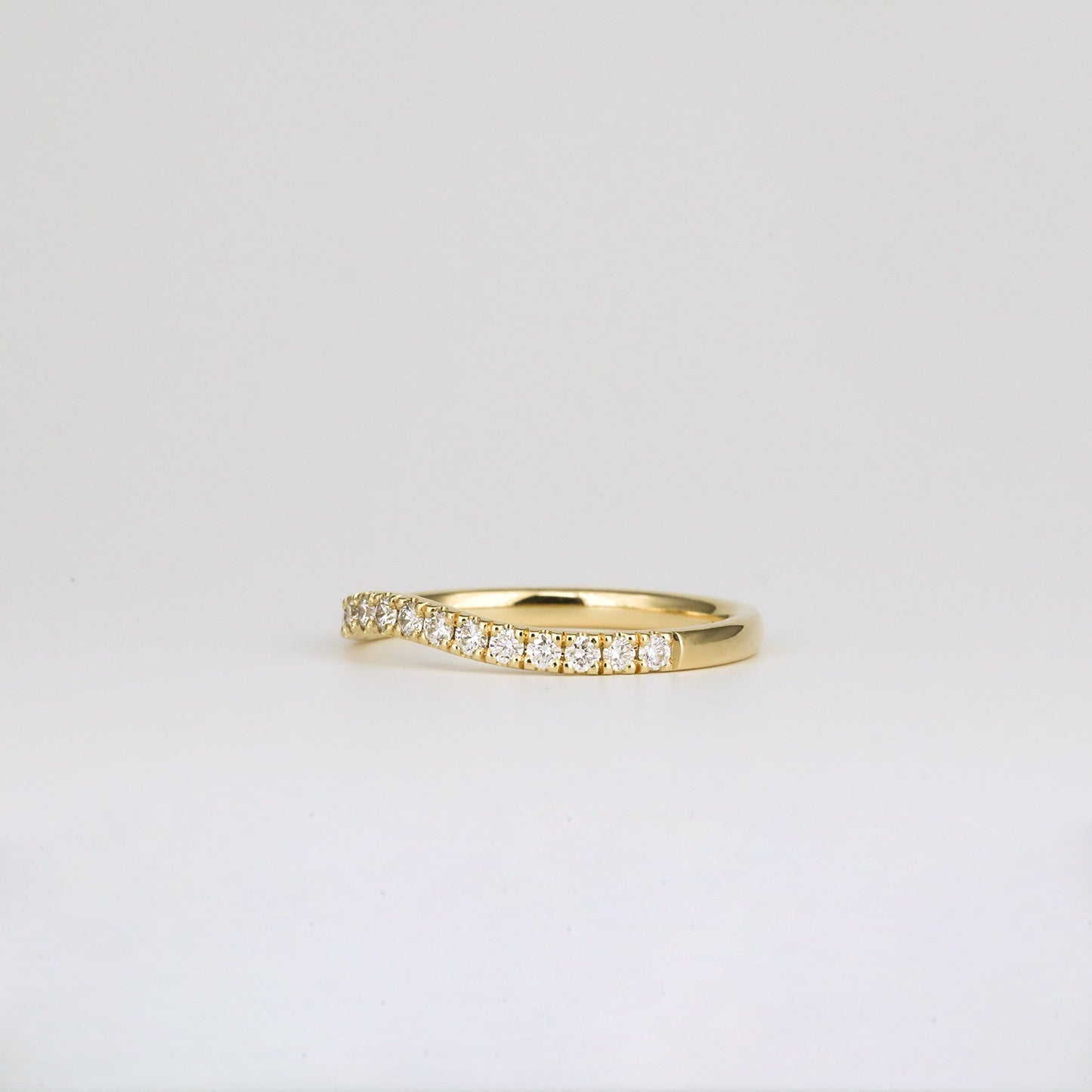 0.33 TCW Round Shaped Curved Moissanite Wedding Band