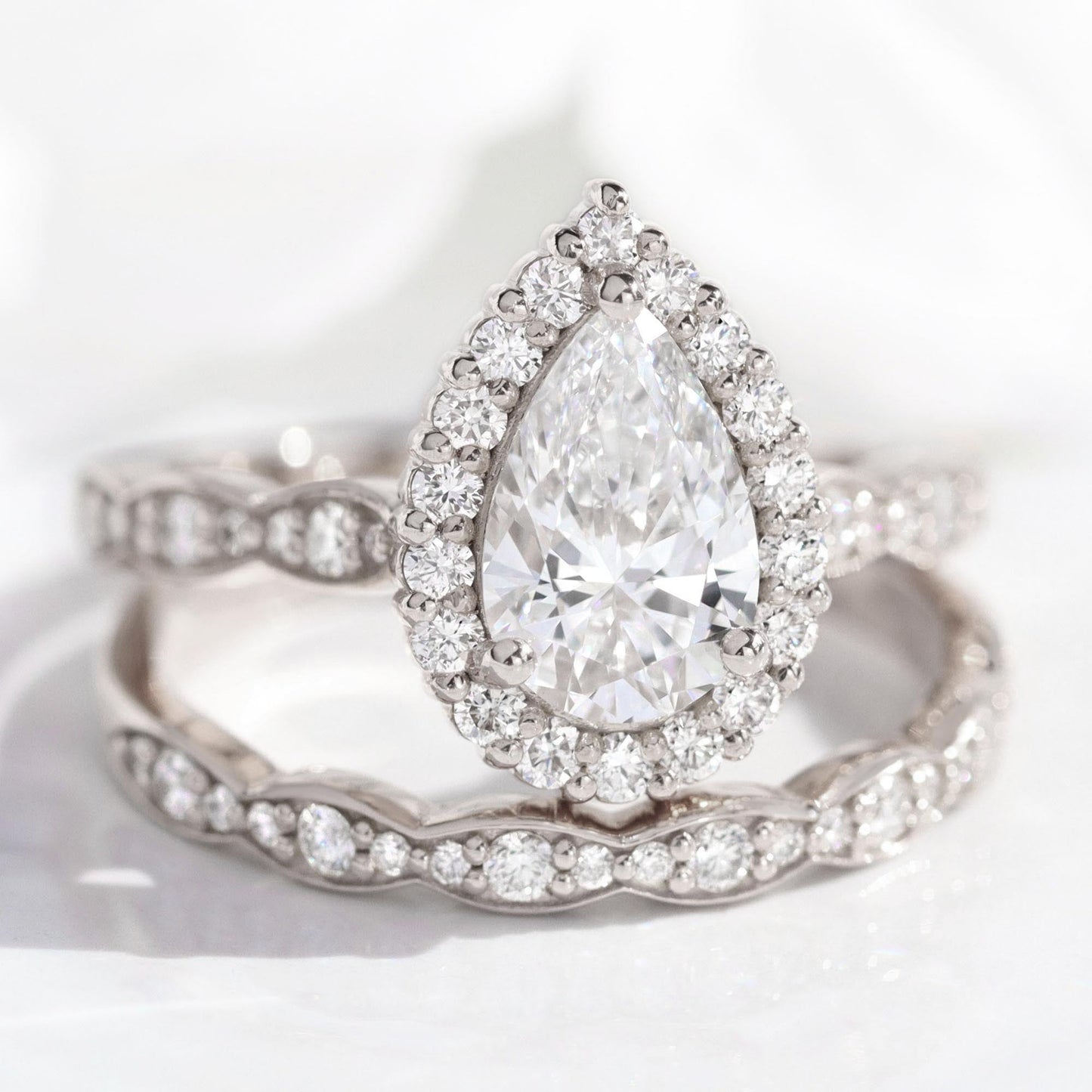 1.2 CT Pear Cut Curved Halo & Pave Moissanite Bridal Ring Set