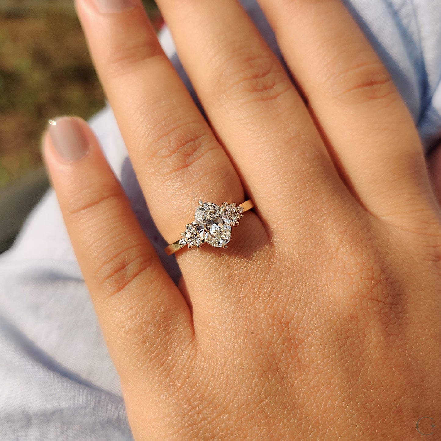 Oval Cut Engagement Ring In Cluster Setting
