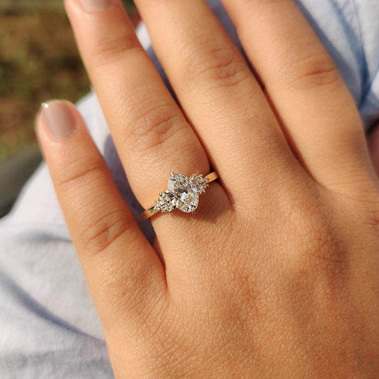 Oval Cut Engagement Ring In Cluster Setting