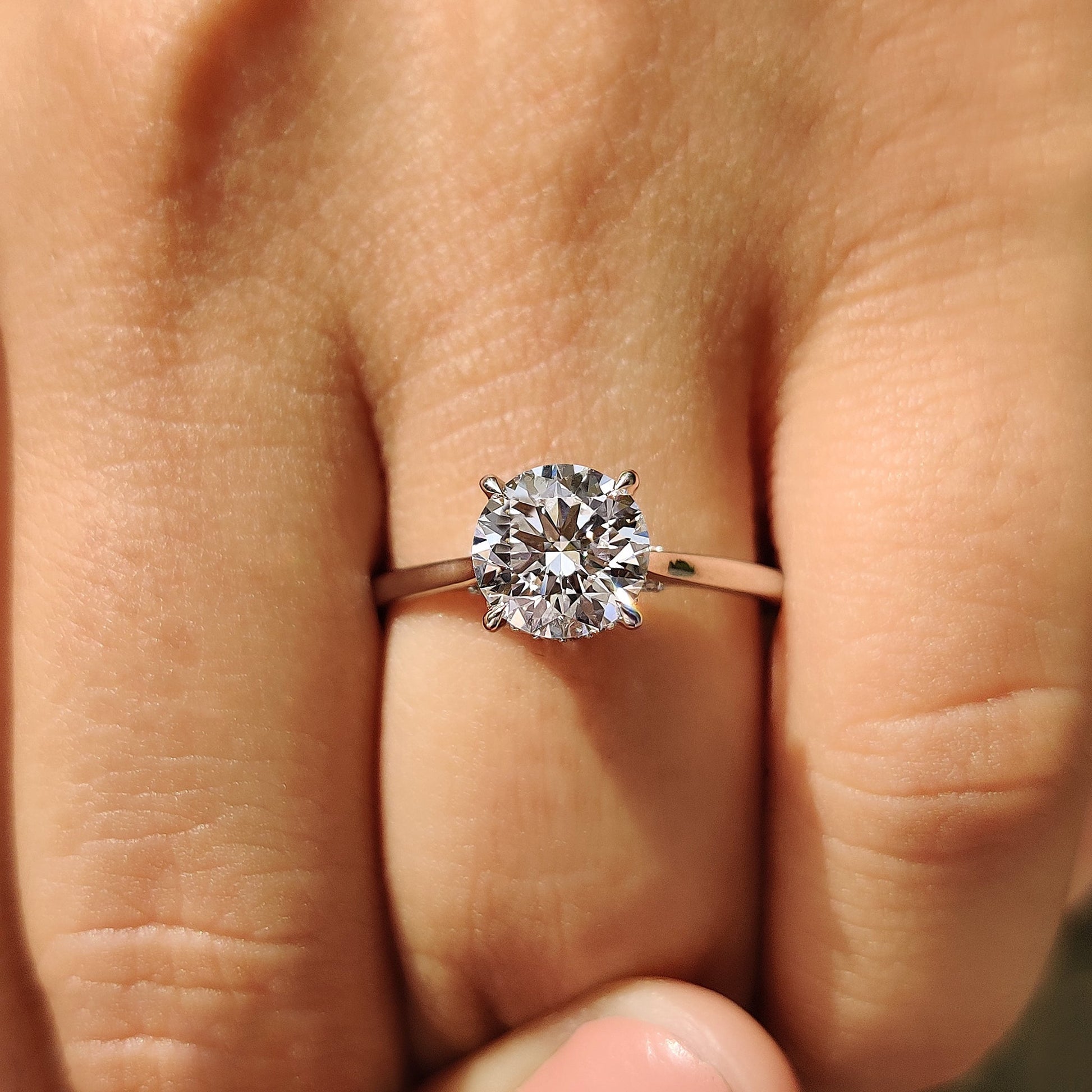 Round Cut Diamond Ring With Cathedral Setting