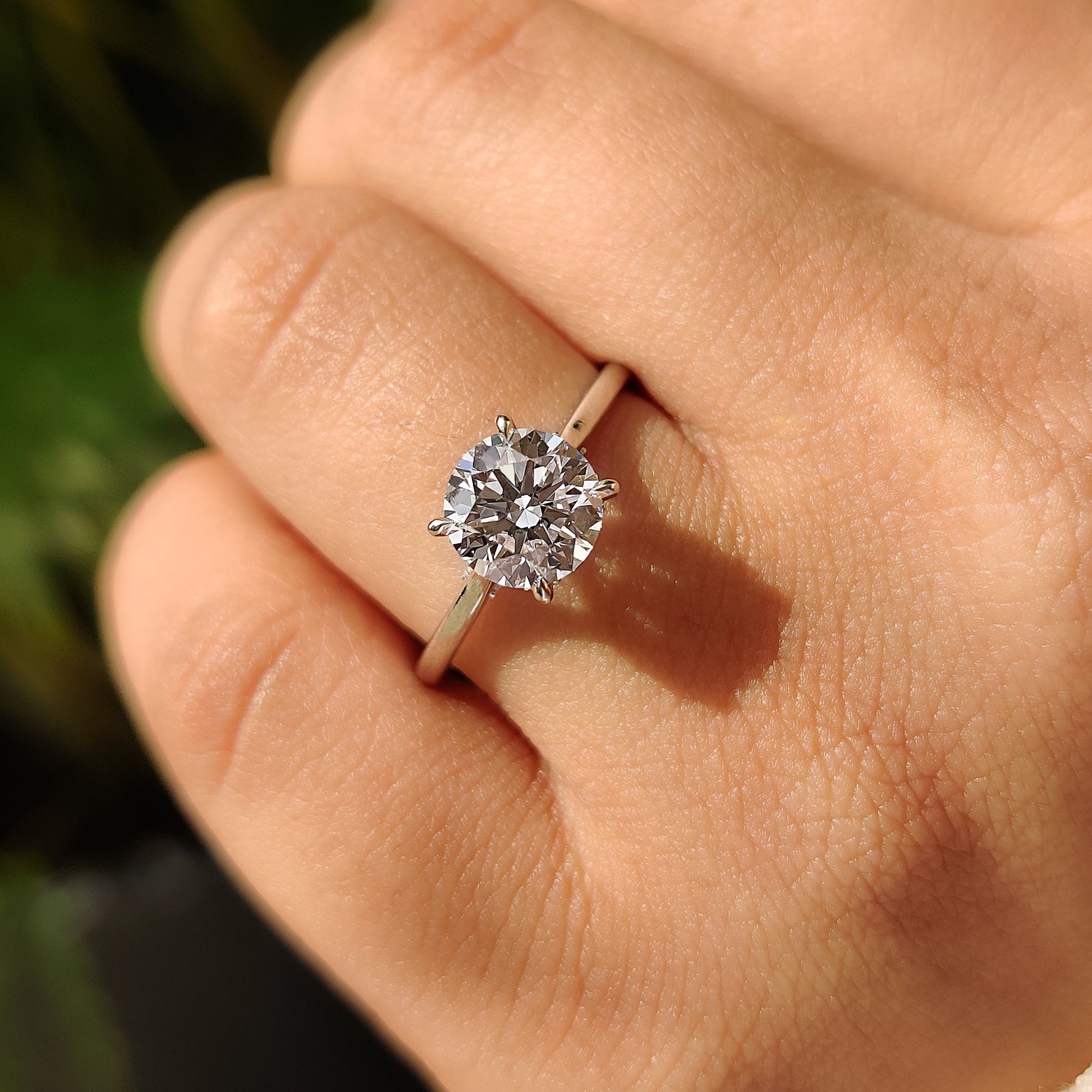 Round Cut Diamond Ring With Cathedral Setting