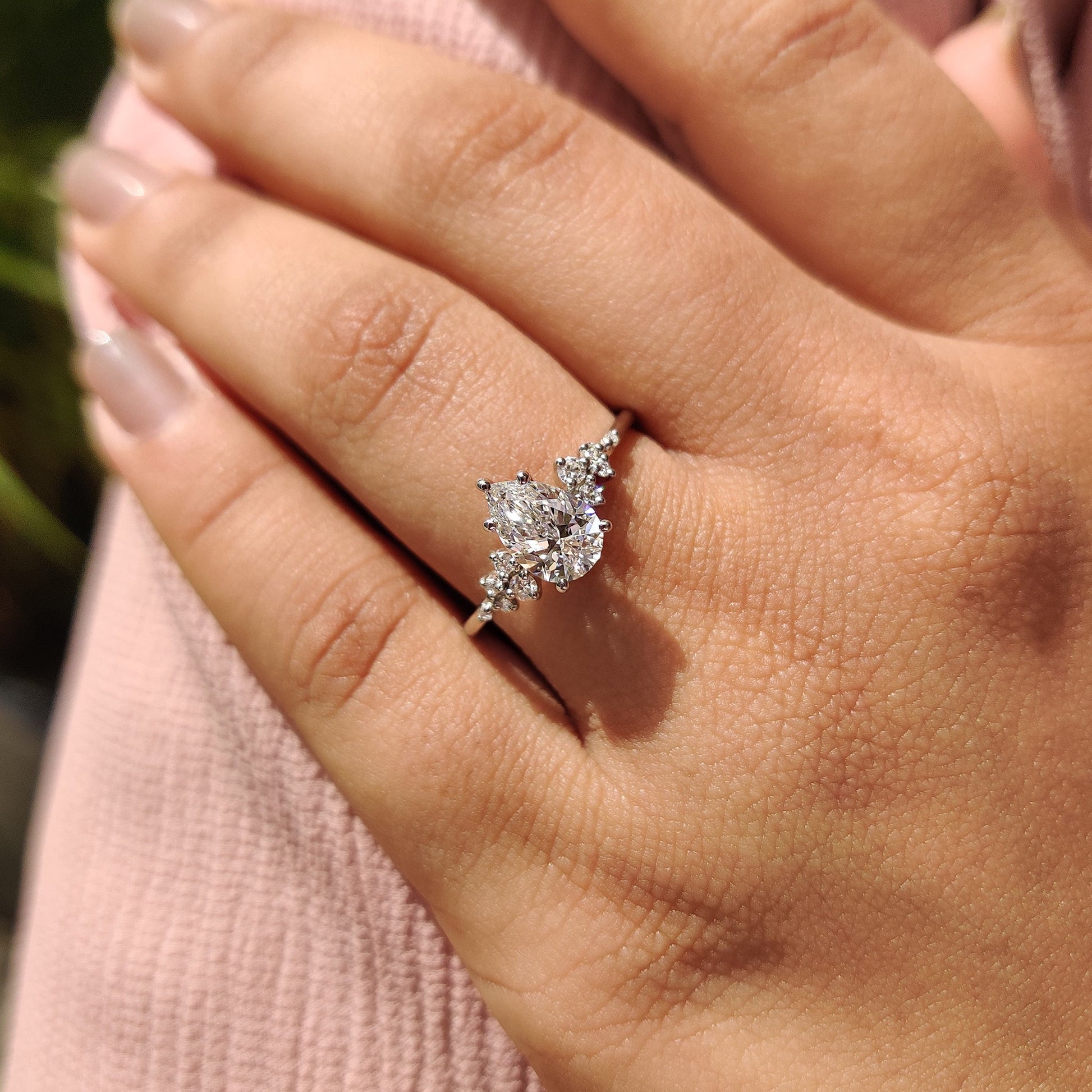 Pear Cluster Diamond Ring With Round Side Stone