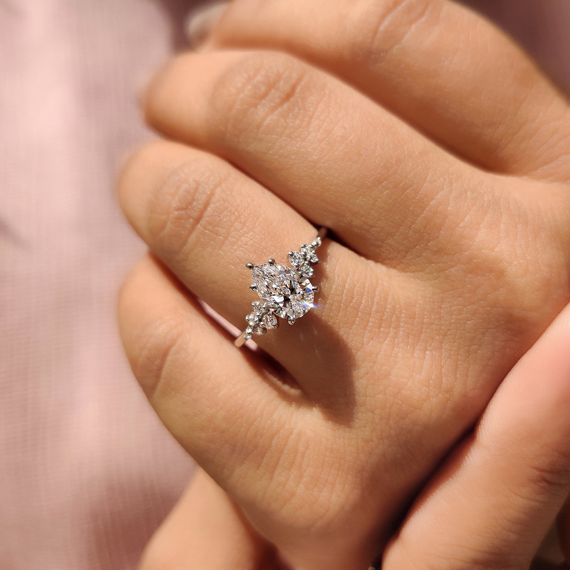 Pear Cluster Diamond Ring With Round Side Stone