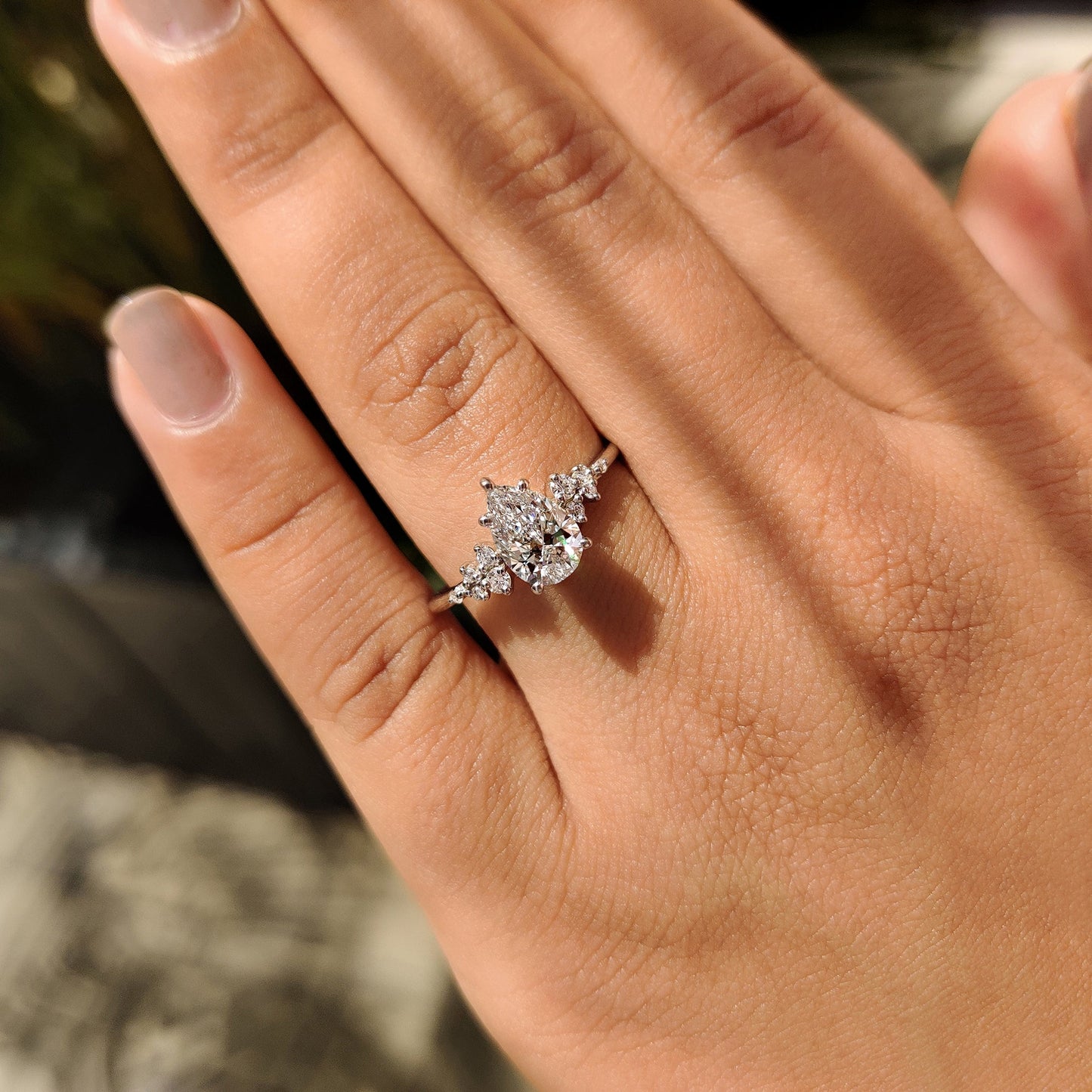 Pear Cluster Diamond Ring With Round Side Stone