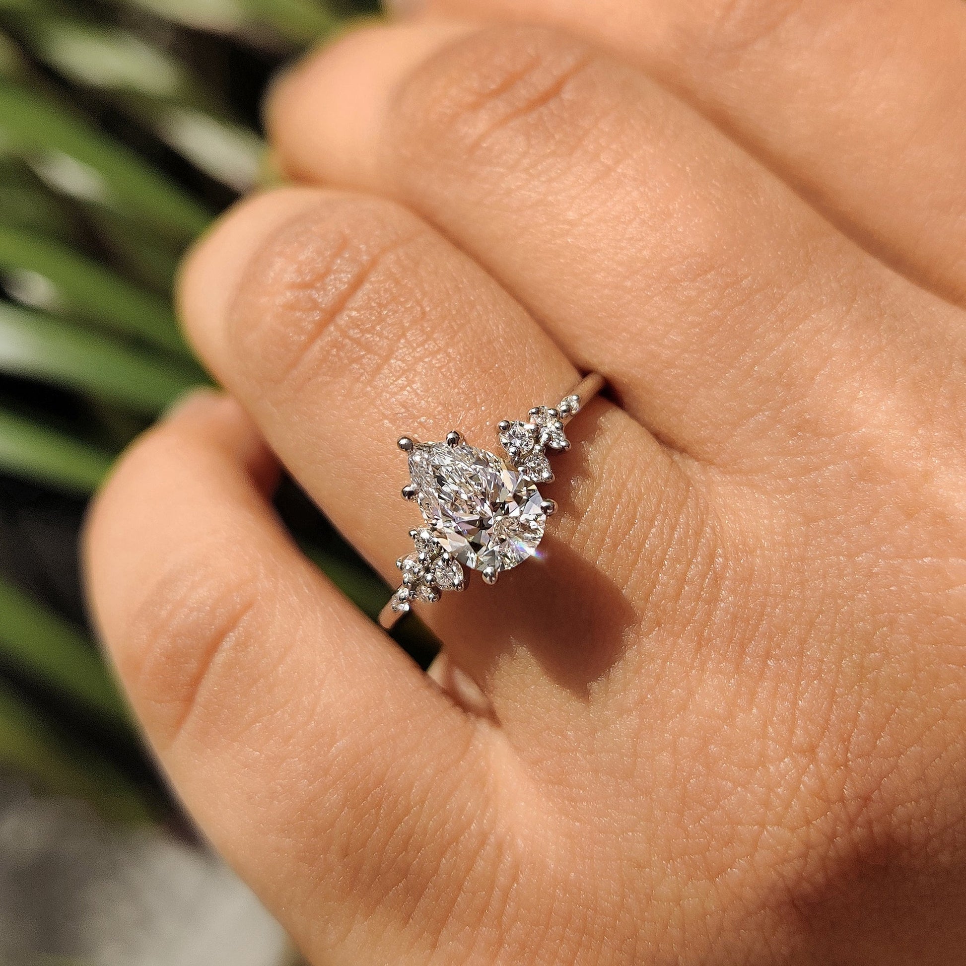 Pear Cluster Diamond Ring With Round Side Stone