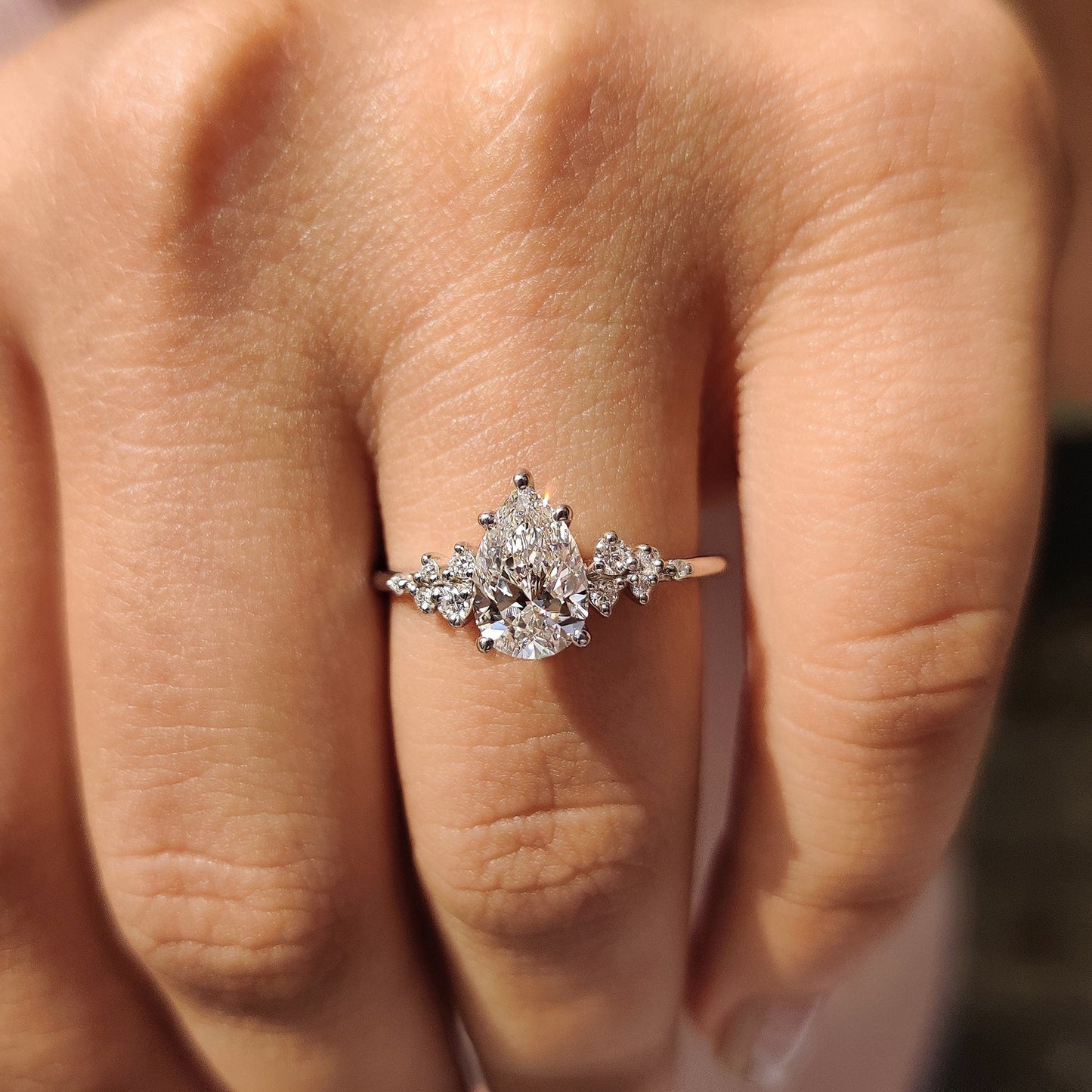 Pear Cluster Diamond Ring With Round Side Stone