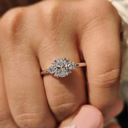 Oval Diamond Ring With Round Cut Side Stone