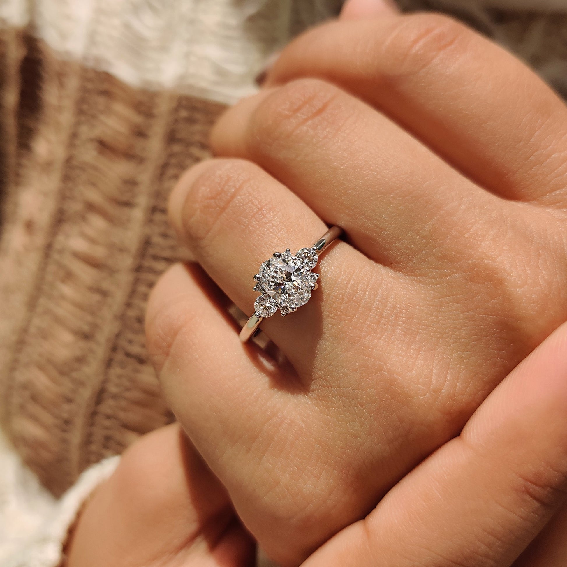 Oval Diamond Ring With Round Cut Side Stone