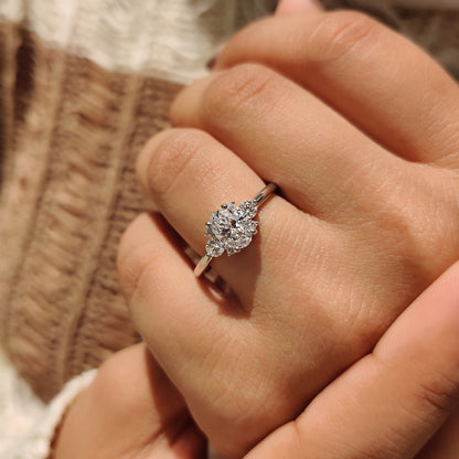 Oval Diamond Ring With Round Cut Side Stone