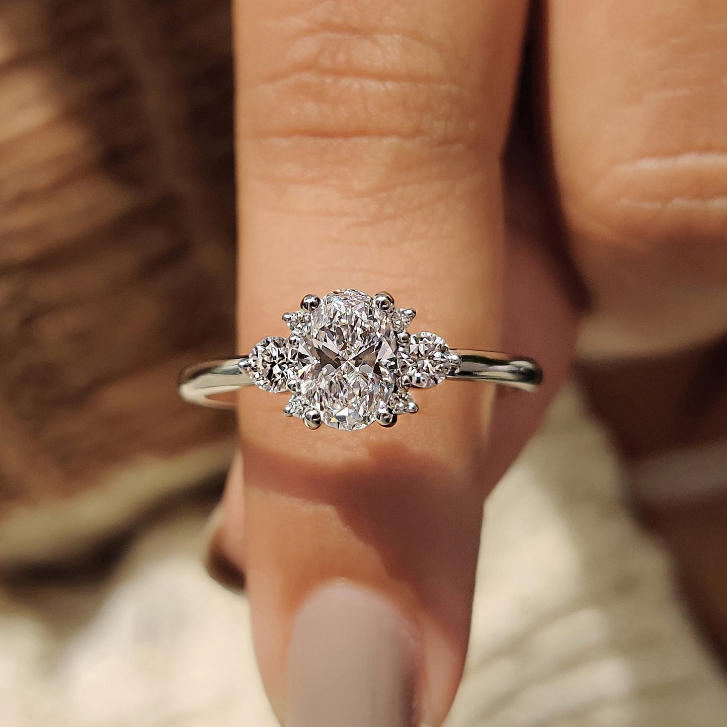 Oval Diamond Ring With Round Cut Side Stone