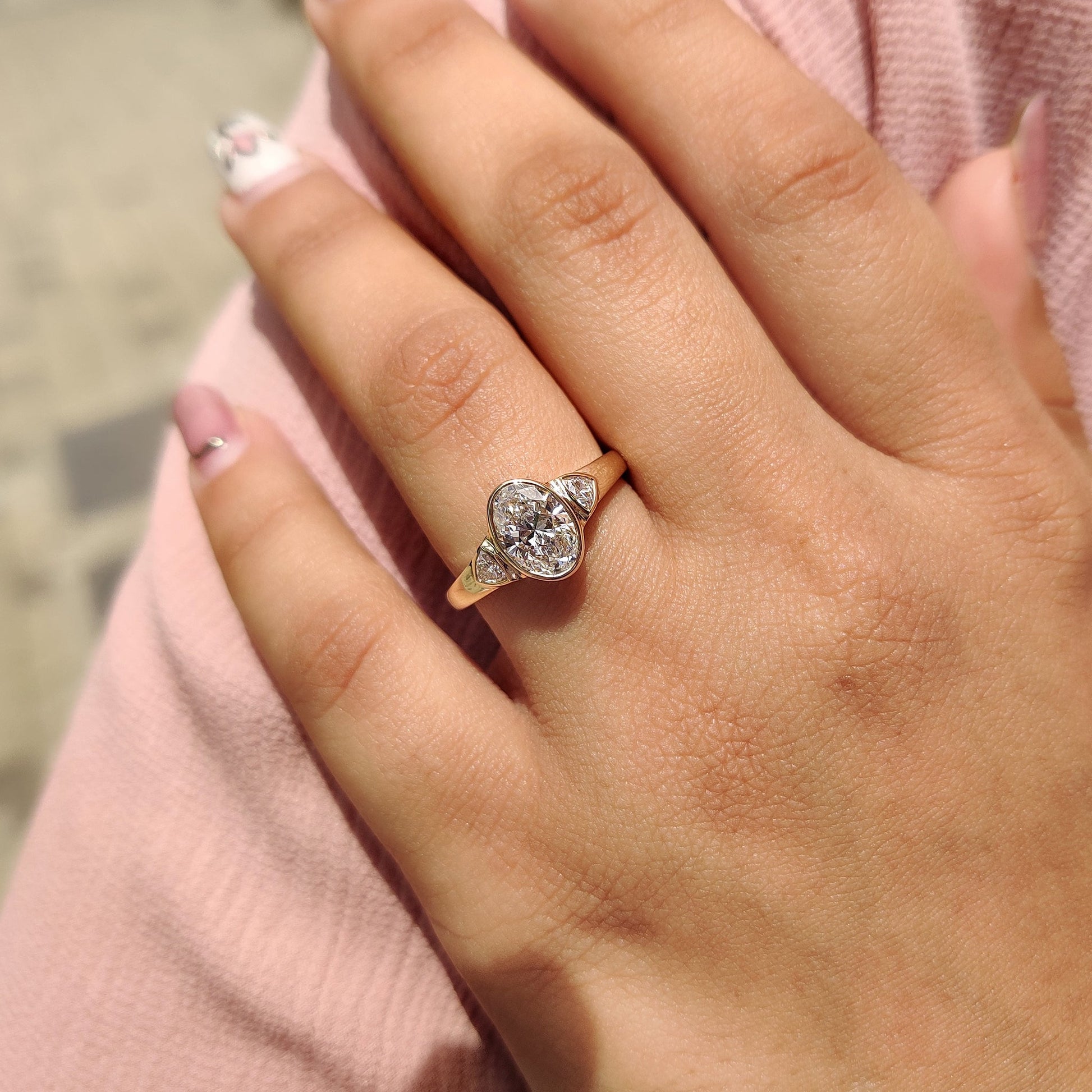 Oval Bezel Engagement Ring With Trillion Side Stone