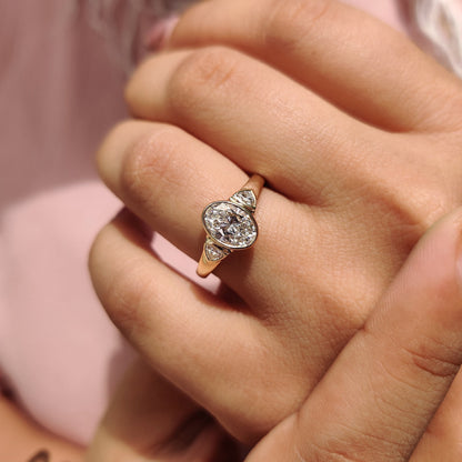 Oval Bezel Engagement Ring With Trillion Side Stone