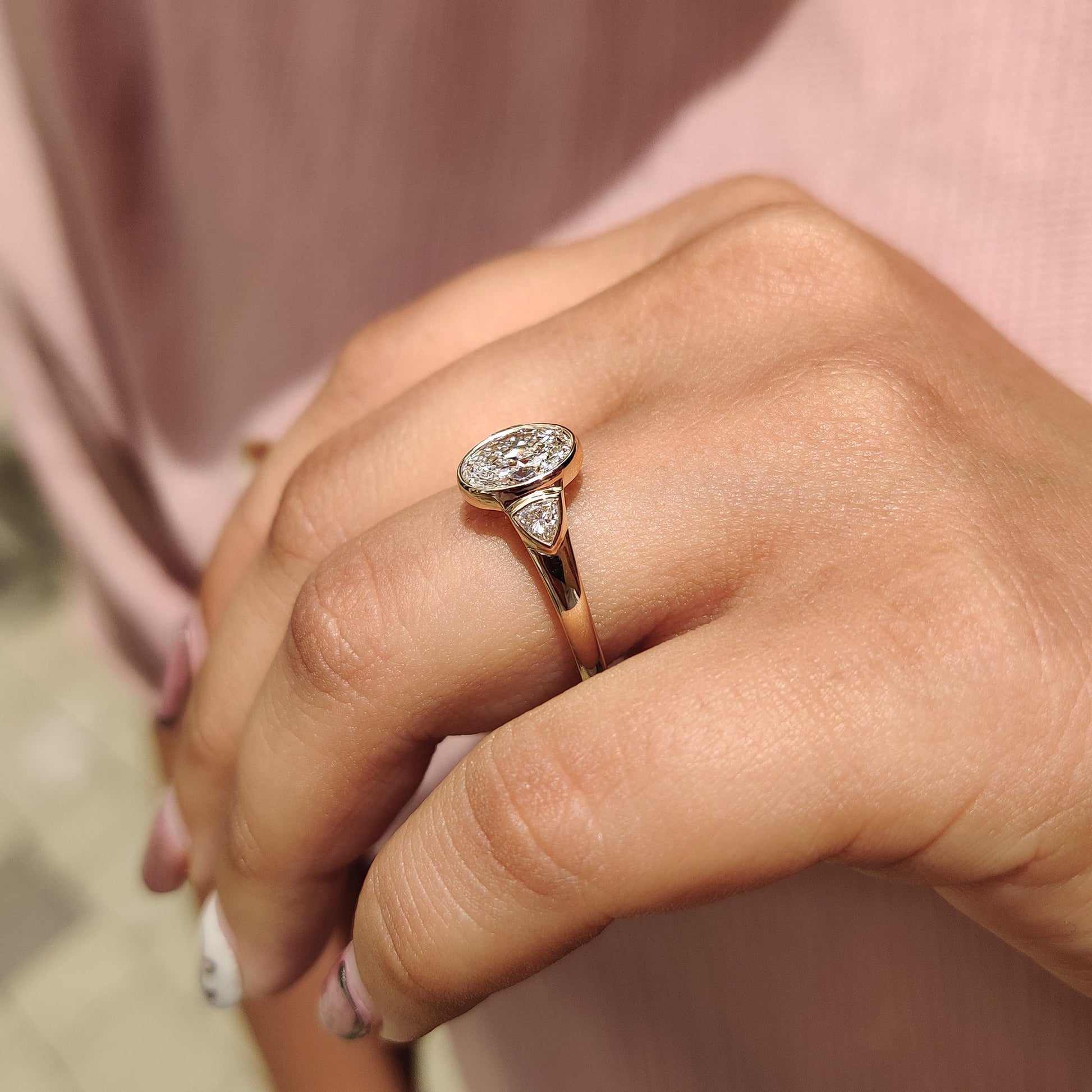 Oval Bezel Engagement Ring With Trillion Side Stone