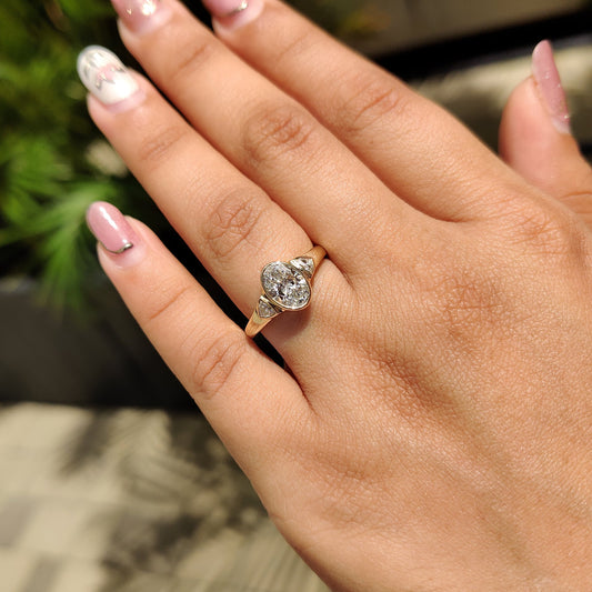 Oval Bezel Engagement Ring With Trillion Side Stone