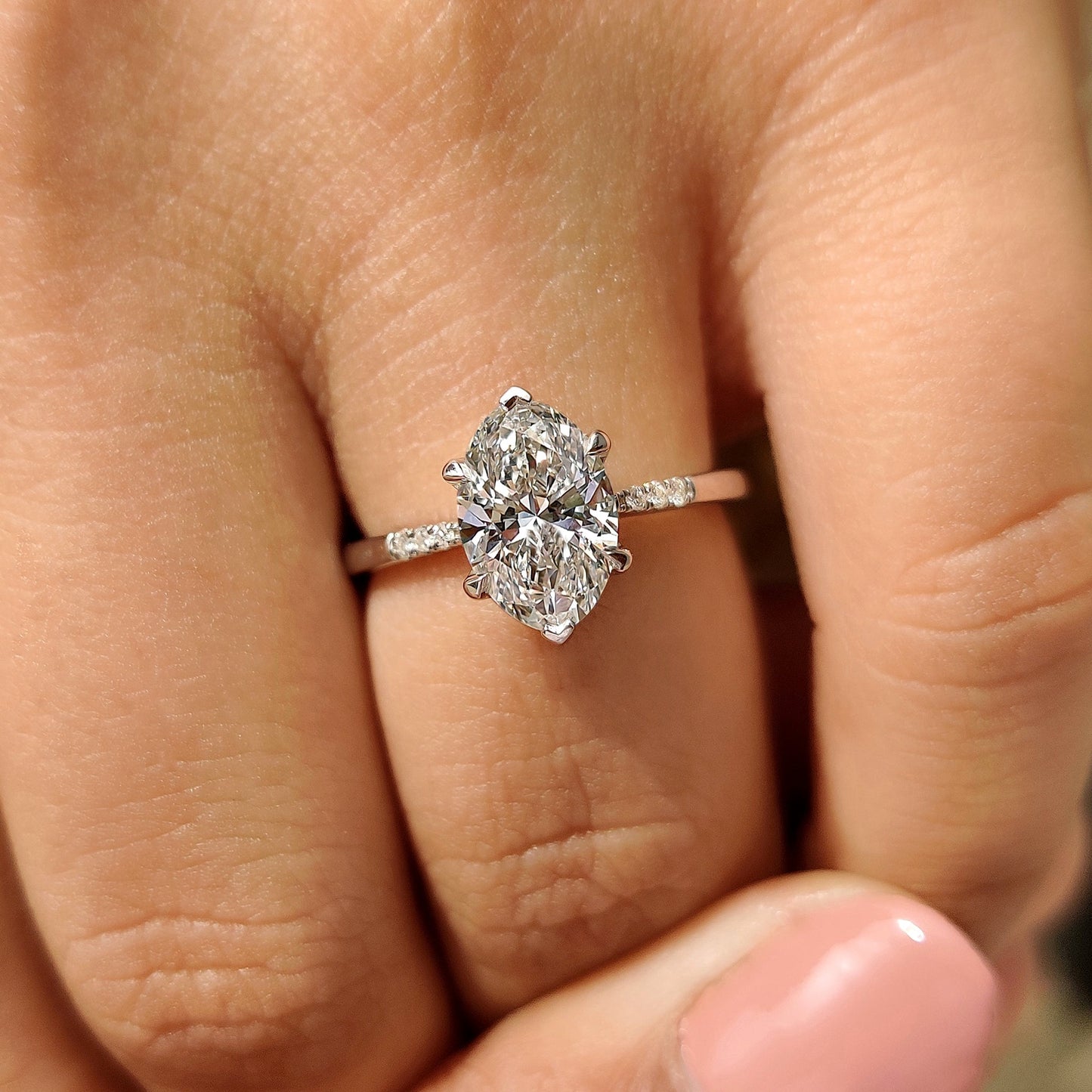 Oval Cut Diamond Engagement Ring With Pave Setting