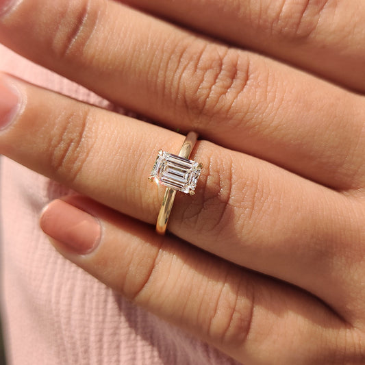 Emerald Cut Solitaire Ring In Yellow Gold With Basket Design