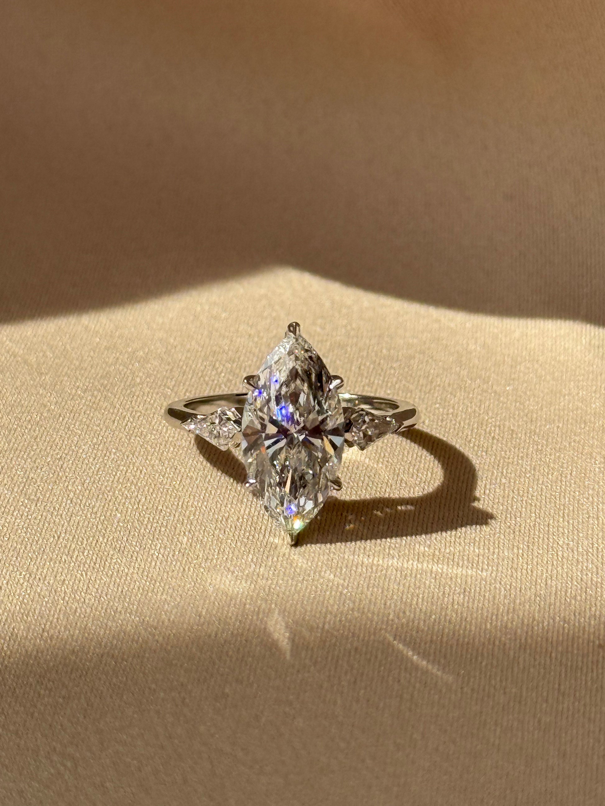 Marquise Shaped Three Stone Lab Grown Diamond Engagement Ring