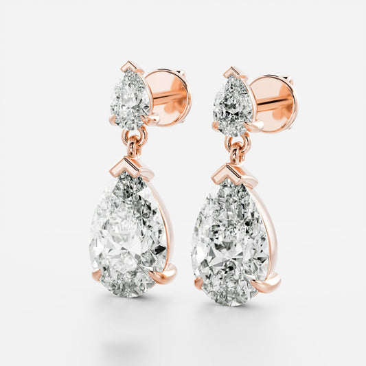 1.2 TCW Pear Cut Moissanite Dangles Earrings in Gold