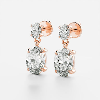 1.2 TCW Oval Cut Moissanite Dangles Earrings in Gold