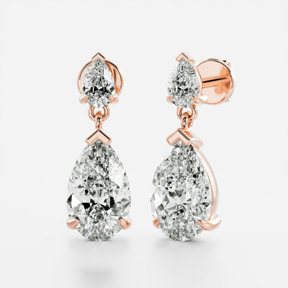 1.2 TCW Pear Cut Moissanite Dangles Earrings in Gold