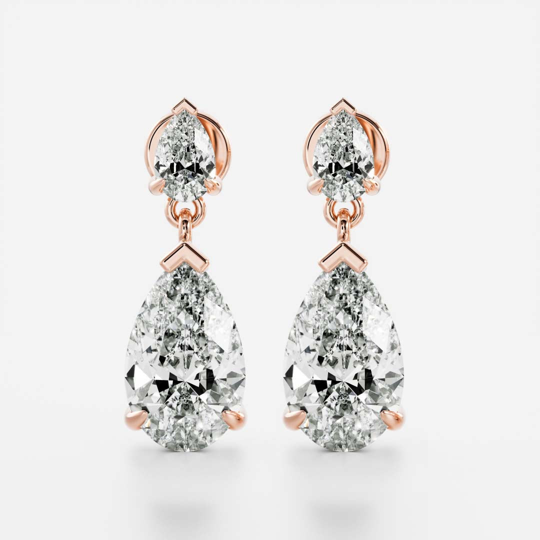 1.2 TCW Pear Cut Moissanite Dangles Earrings in Gold