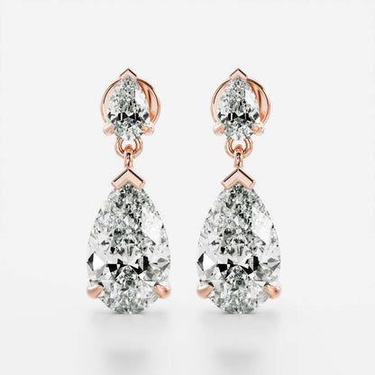 1.2 TCW Pear Cut Moissanite Dangles Earrings in Gold