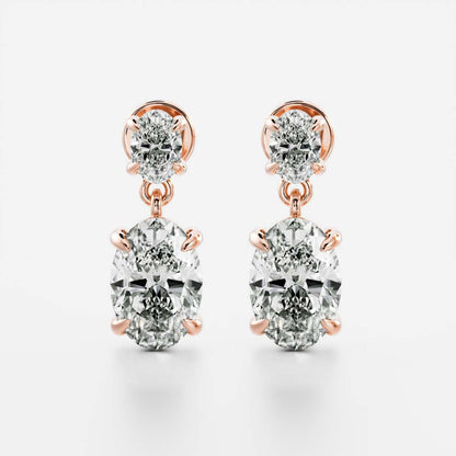 1.2 TCW Oval Cut Moissanite Dangles Earrings in Gold