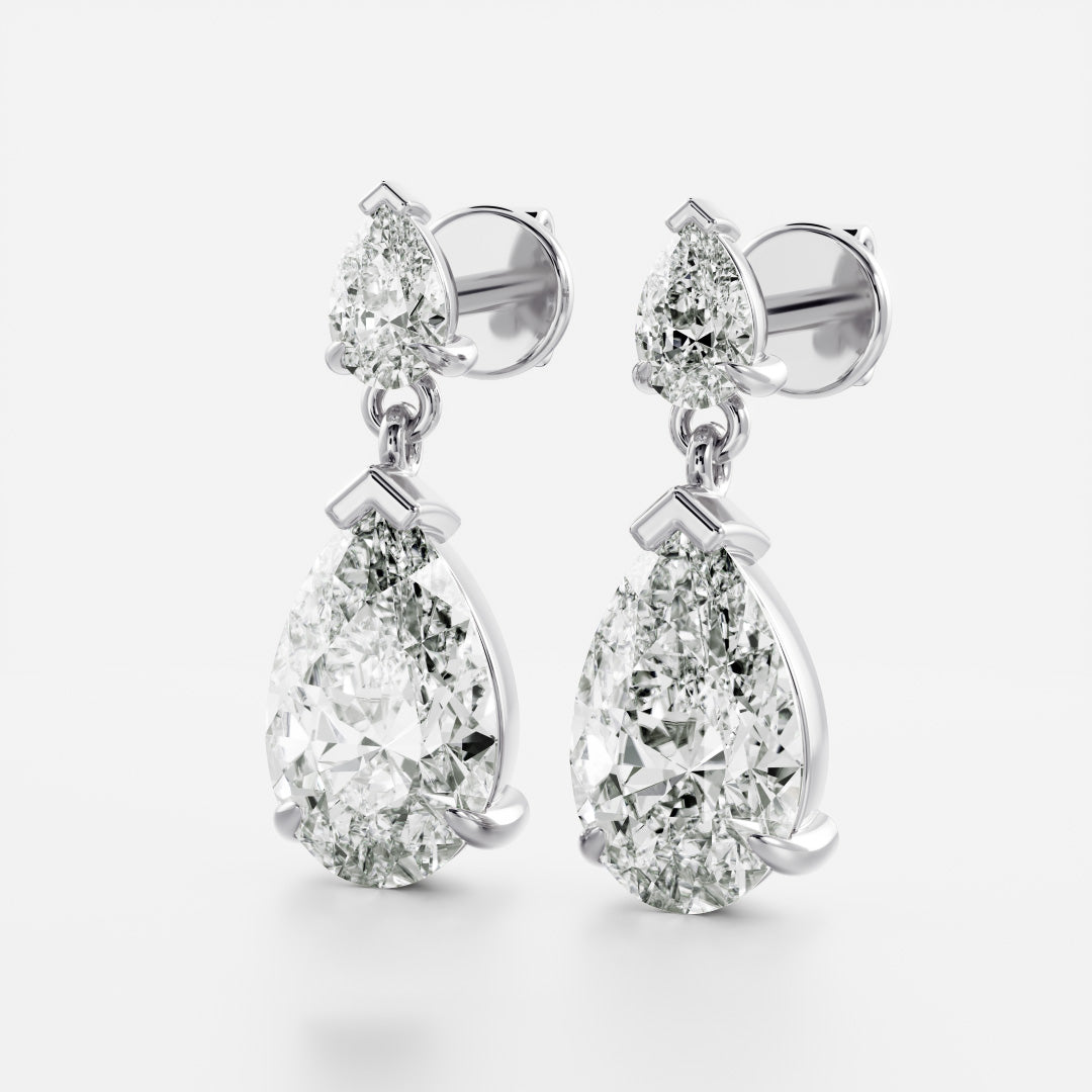 1.2 TCW Pear Cut Moissanite Dangles Earrings in Gold
