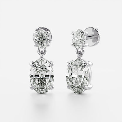 1.2 TCW Oval Cut Moissanite Dangles Earrings in Gold